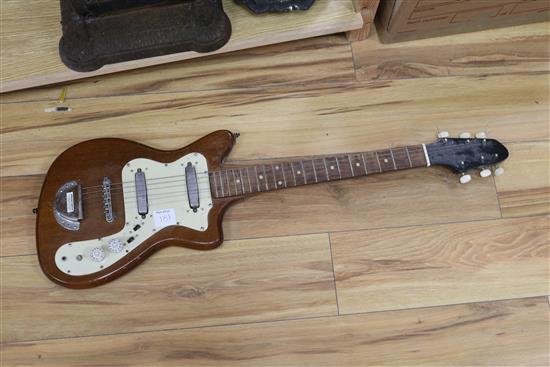 Three electric guitars and an acoustic guitar